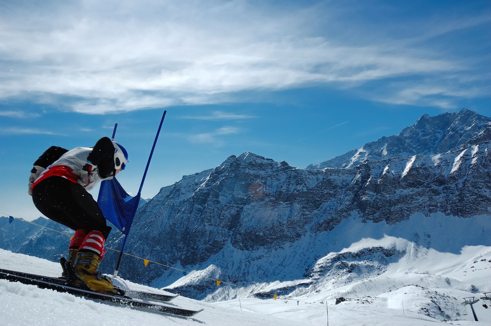 A person skiing down a hill in the wintertime