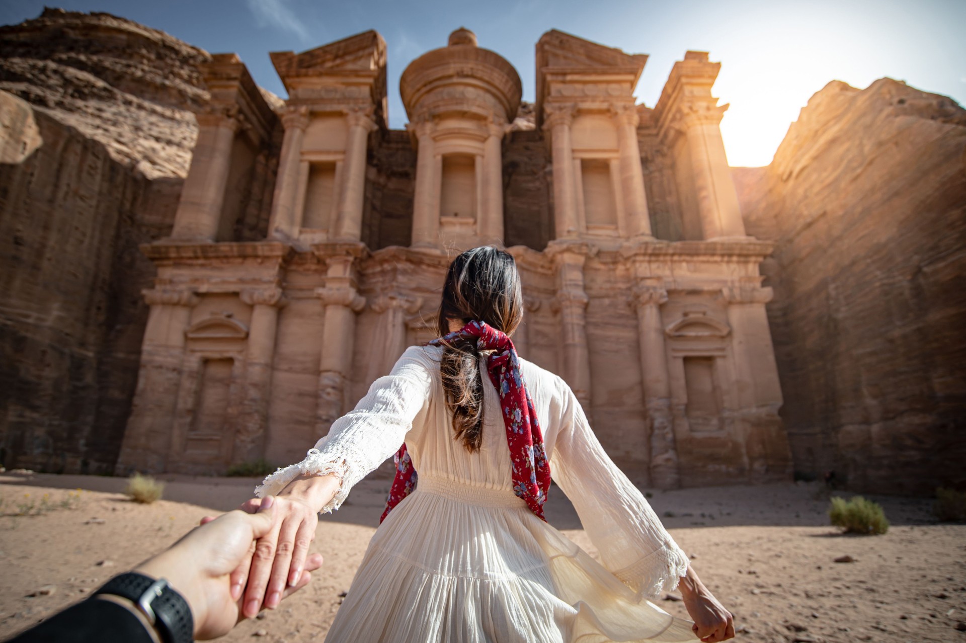 Asian woman tourist holding hand in Petra, Jordan