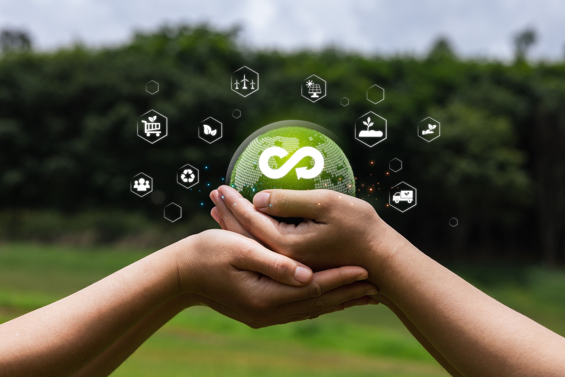Hands Holding Sustainable Globe with Eco-friendly Icons Surrounding